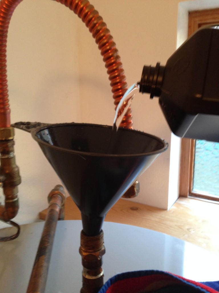 Pour in 1 cup of hydrogen peroxide for every 10 gallons of tank capacity