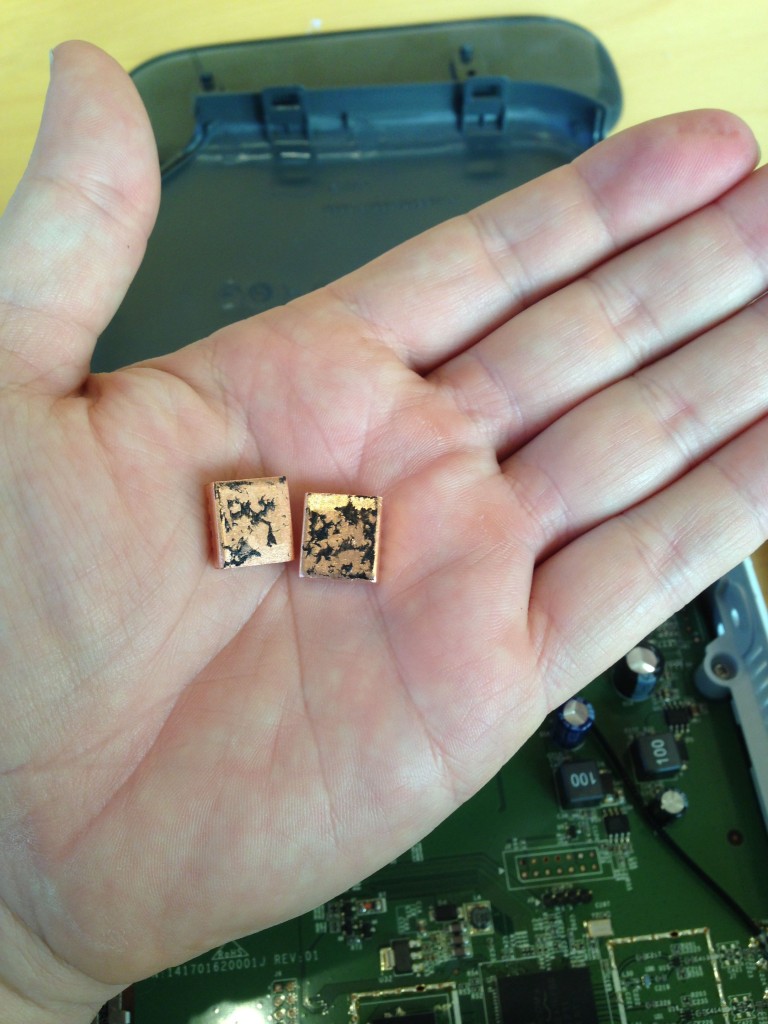 My first pass at removing the supplied adhesive from the heat sinks.