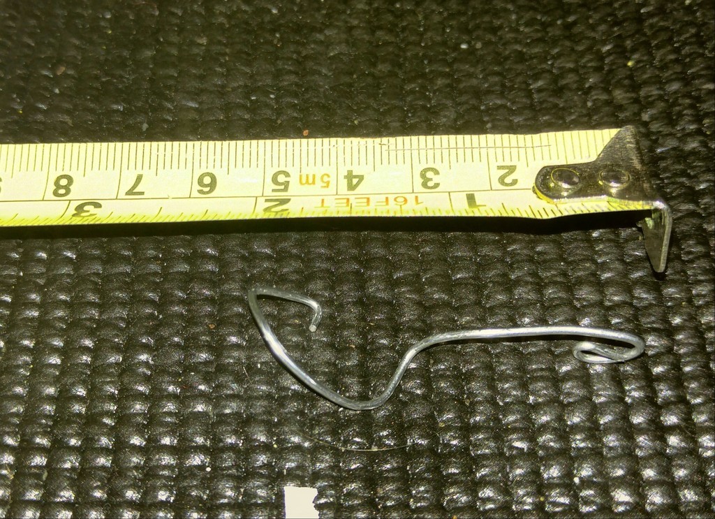 installing a paperclip folded liks this in an MPX can help lift the charging handle to avoid wear (courtesy of Dieseljayy).