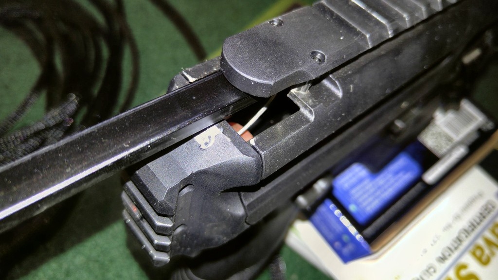 The paperclip fix can be seen when the charging handle is pulled back (courtesy of Dieseljayy).