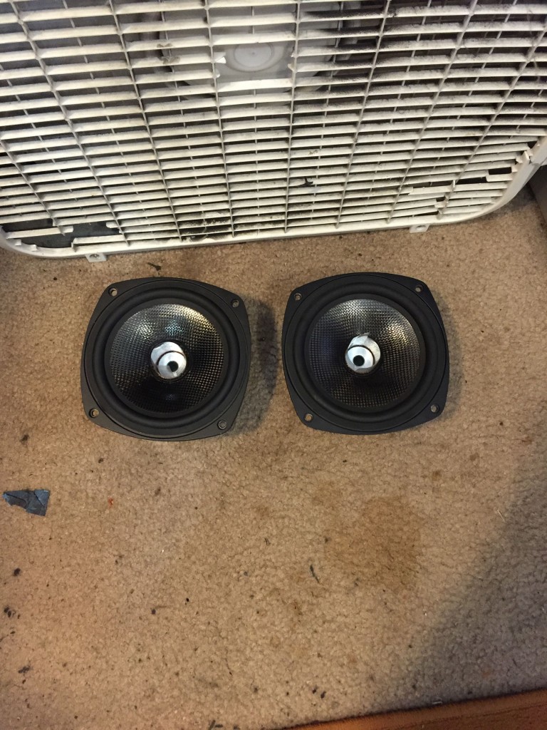 Woofers with re-glued spiders drying.
