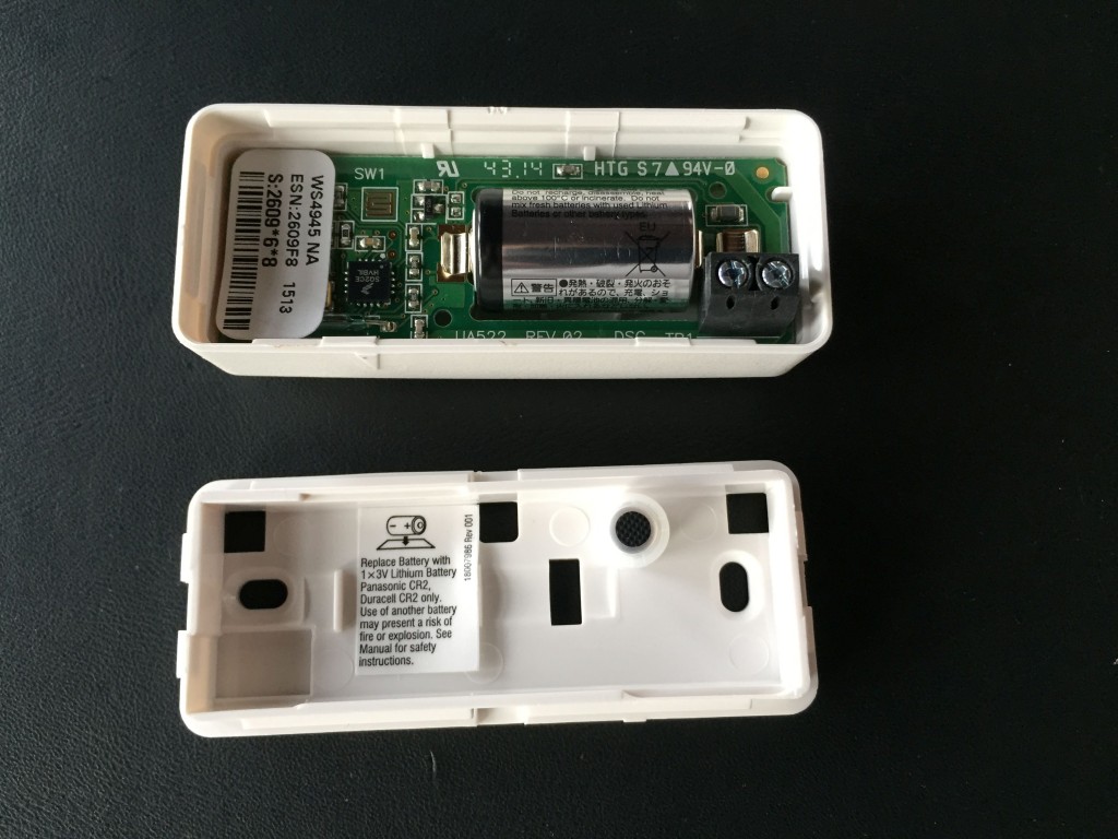 Dry contact terminals on a DSC W4945 sensor.