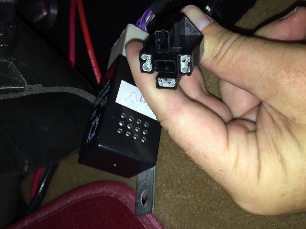 The turn signal flasher relay plug is located under the passenger side dash.