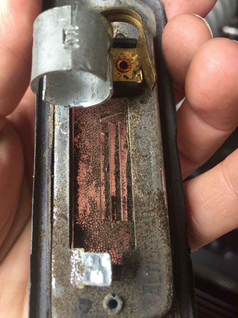 Dirty license plate light lens