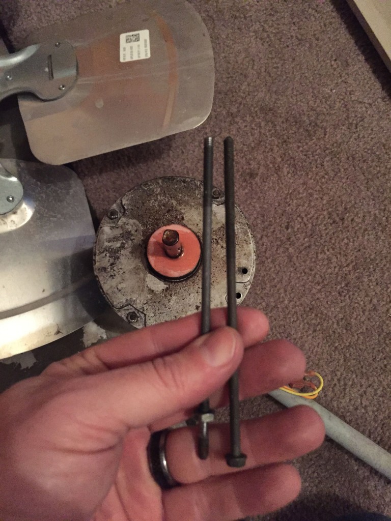 Original motor mount bolt next to the new one... which is just slightly longer