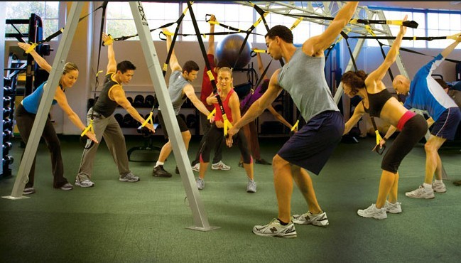 TRX suspension trainer setup at a commercial gym