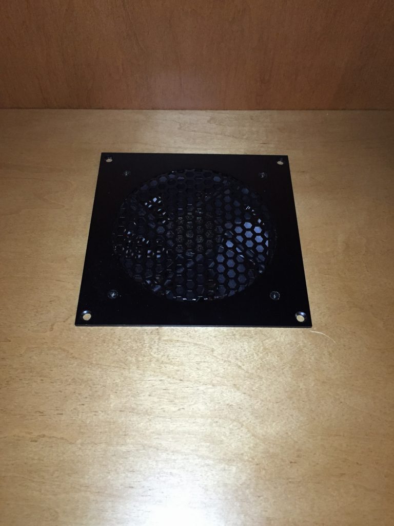 Fan flush mounted into the top of the cabinet