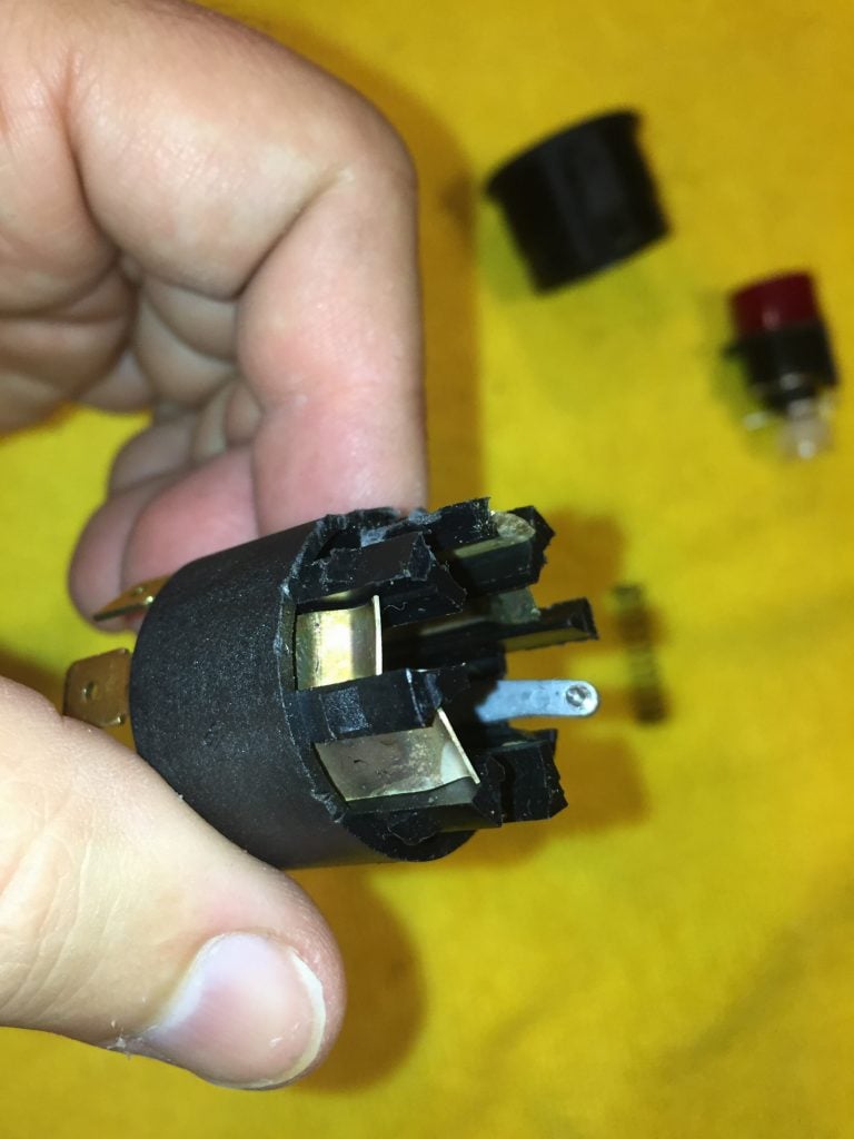 A bent silver tab is the likely cause of your switch's problem