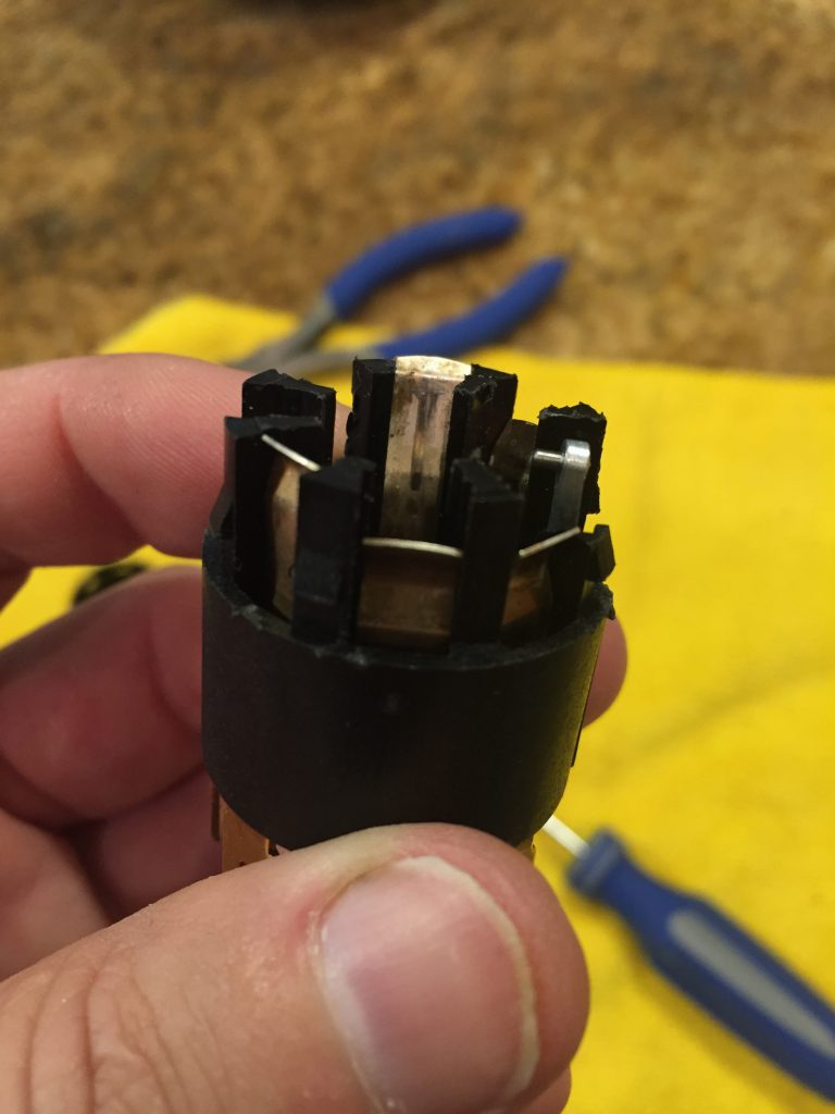 Silver tab bent back into position