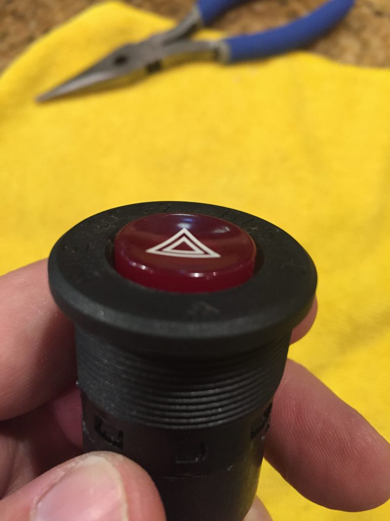 Ferrari 328 hazard button in the down position