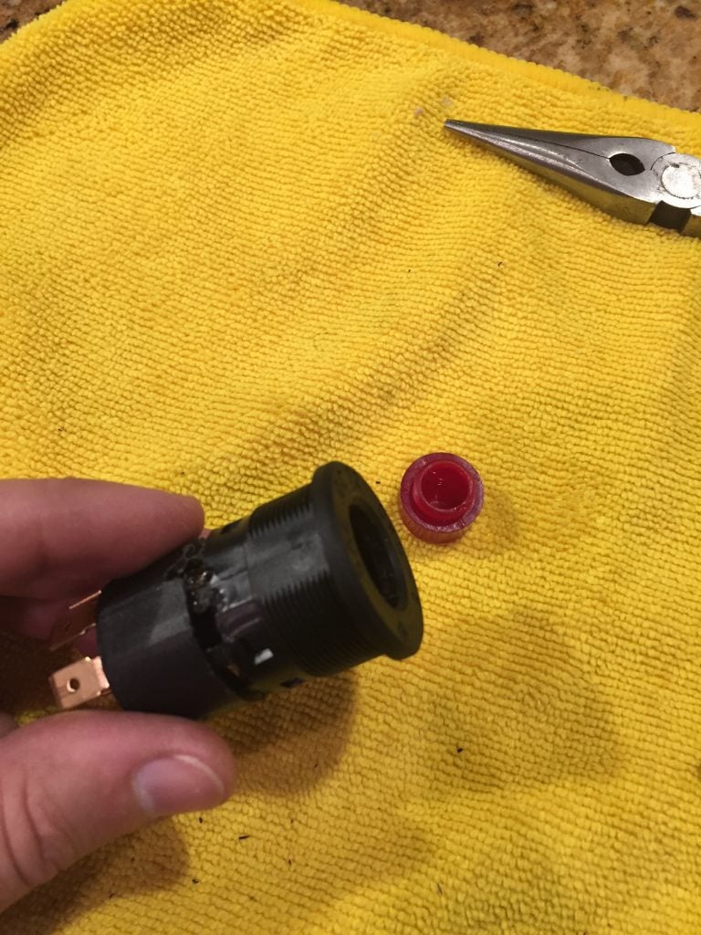 Removing the red cap helps when re-assembling the switch