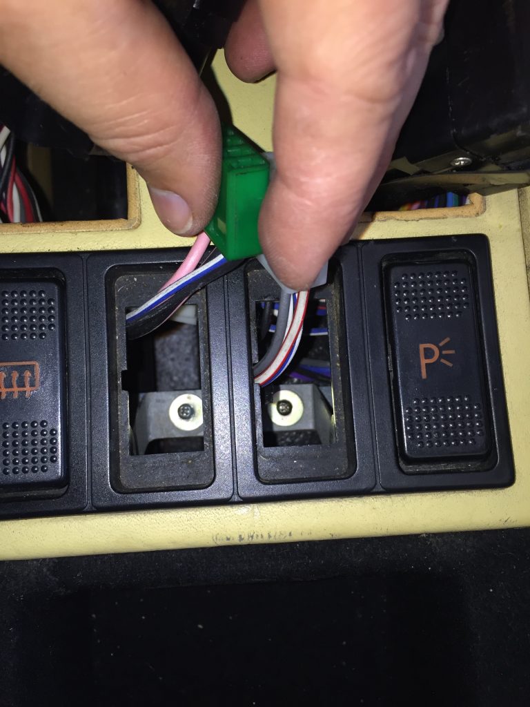 Two rear screws holding the panel into place