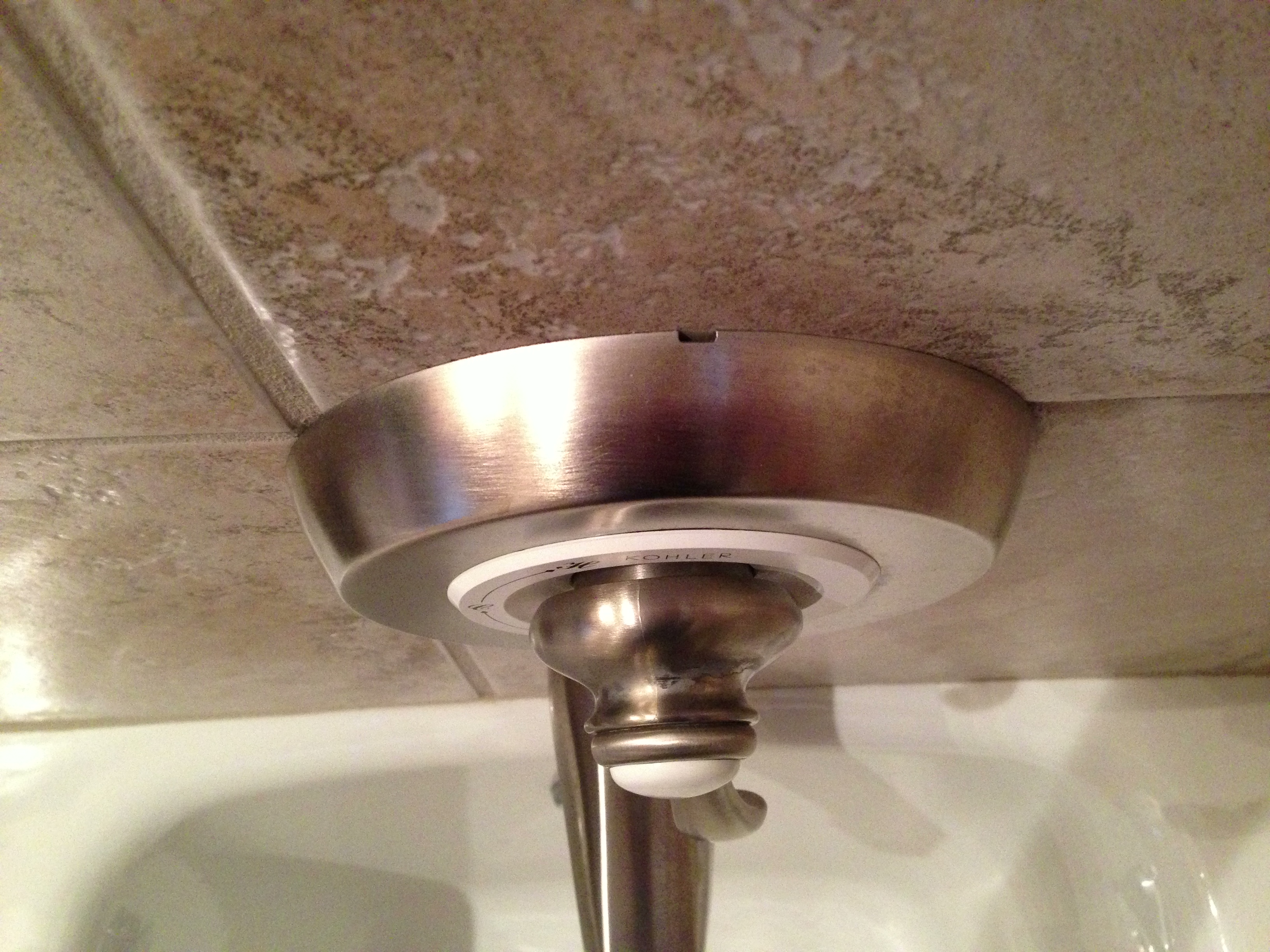 Small opening at the top of the faucet's trim